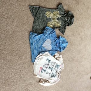 A set of 3/4 sleeve shirts and one short sleeve